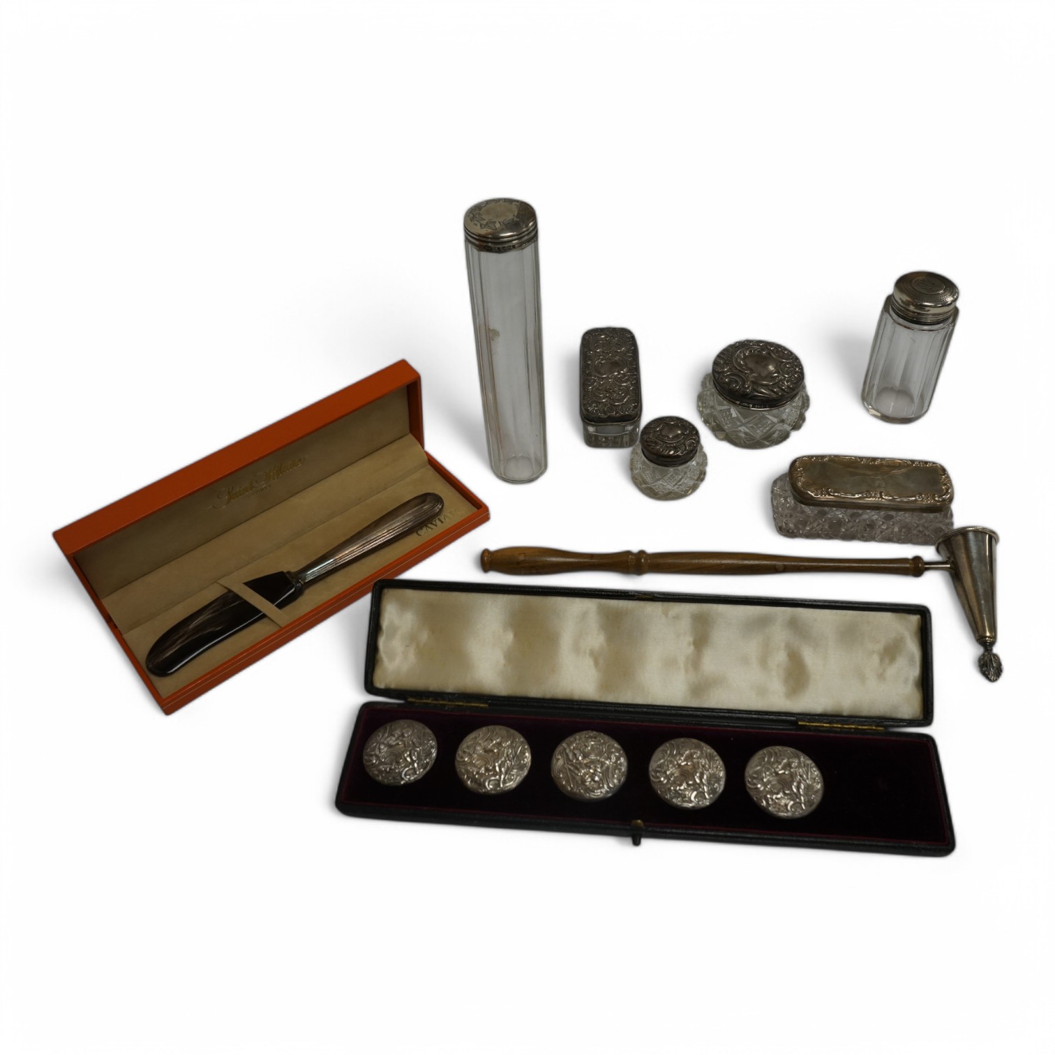 A cased set of five(ex 6) Edwardian repousse silver buttons, import marks for London, 1902, 33mm, a modern wooden handled silver extinguisher, six assorted Victorian and later silver mounted glass toilet jars and a cased